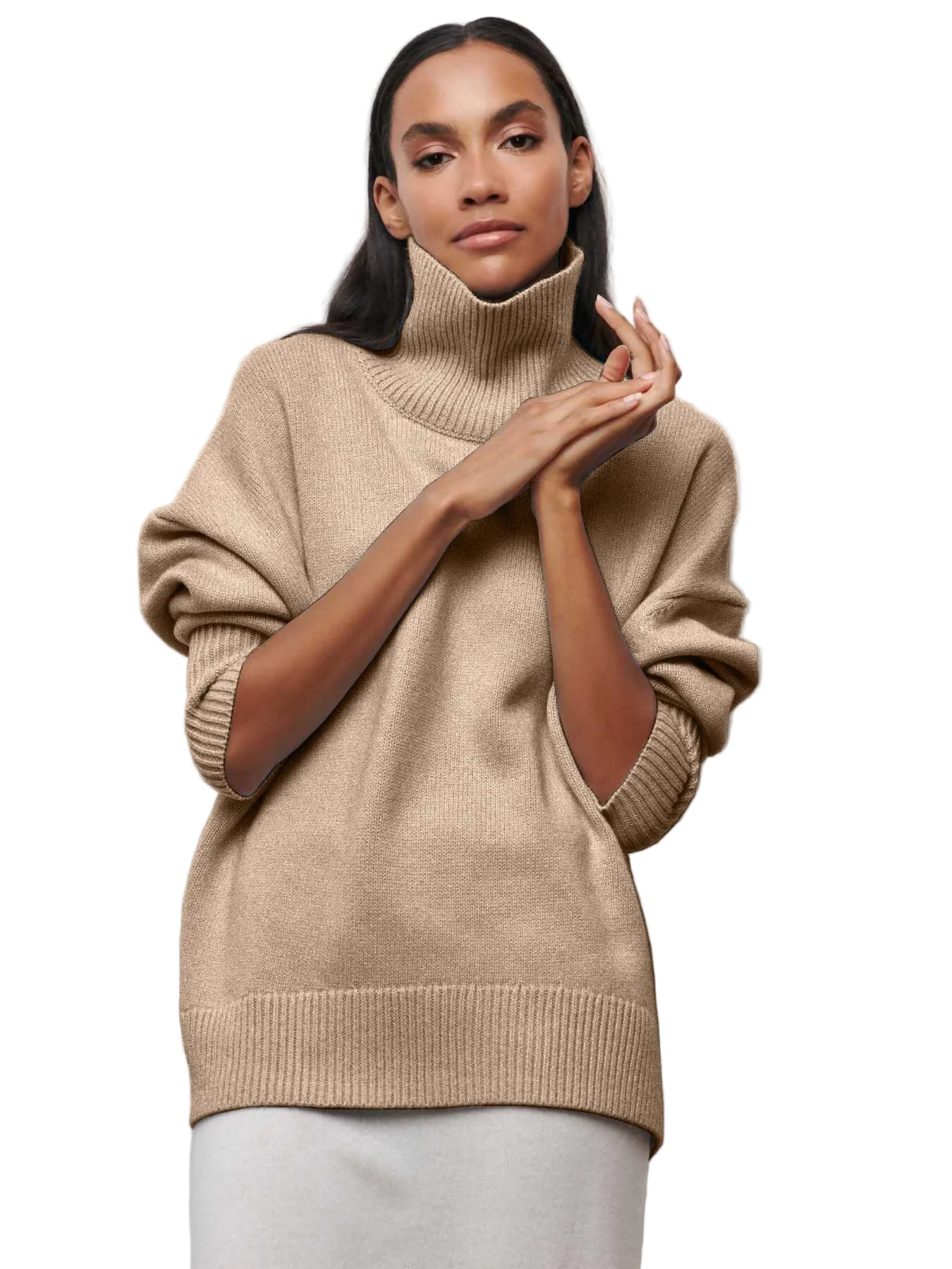 Woman wearing a beige turtleneck sweater against a plain background