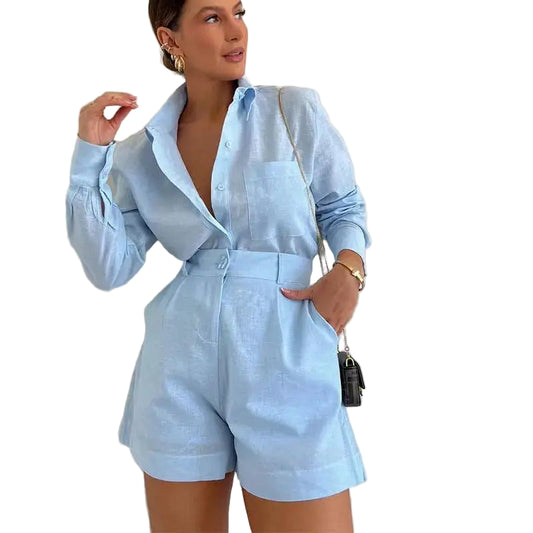 Woman wearing a light blue outfit against a plain background