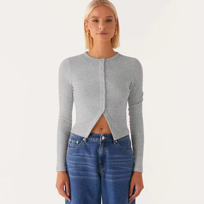 Person wearing a gray cardigan and blue jeans on a white background