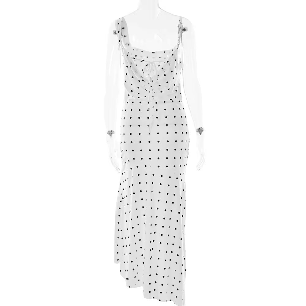 White dress with black polka dots on a white background