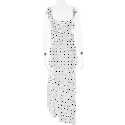 White dress with black polka dots on a white background