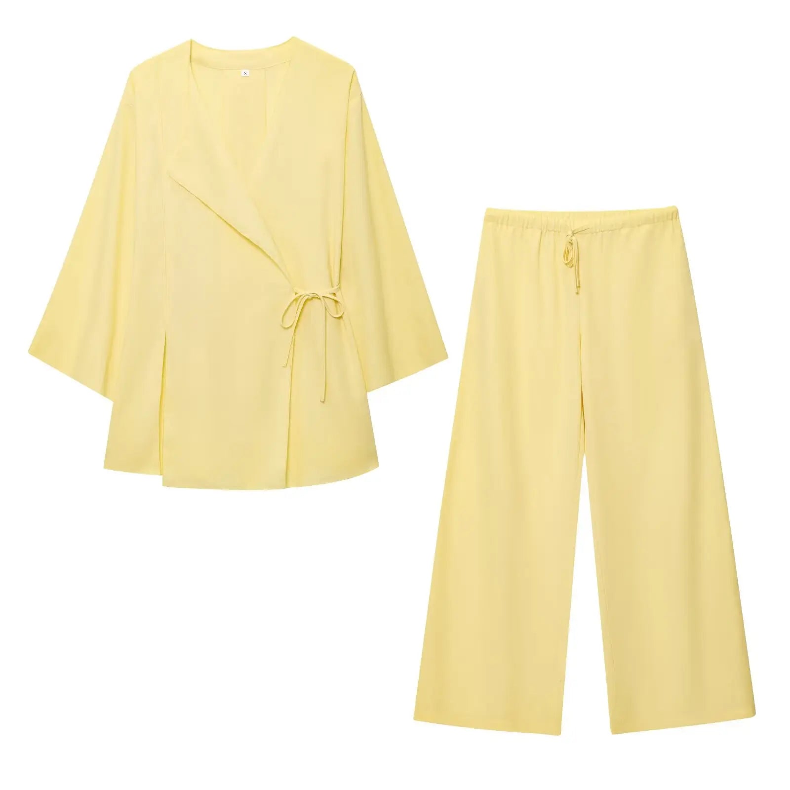 Yellow outfit with a top and pants on a white background