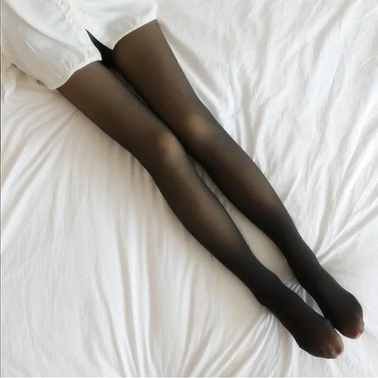 Black tights worn by a person on a white bed