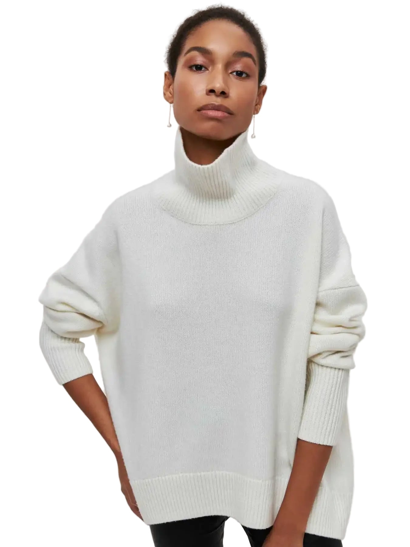 Person wearing a white turtleneck sweater on a plain background