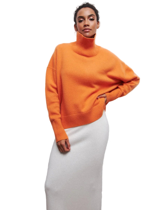 Person wearing an orange sweater on a white background