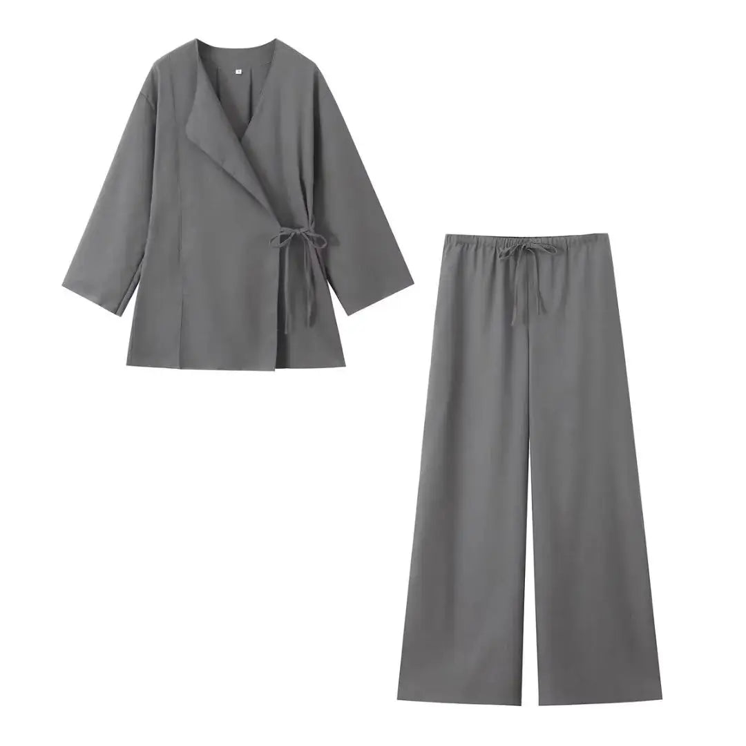 Gray outfit with a jacket and pants on a white background