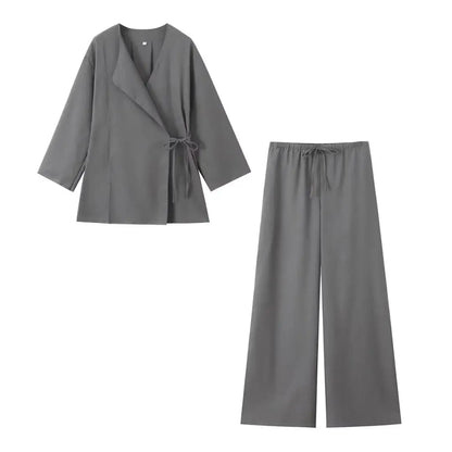 Gray outfit with a jacket and pants on a white background