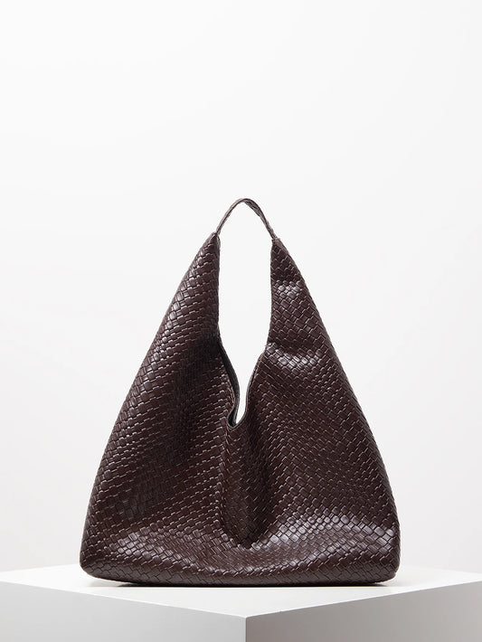Brown textured handbag on a white background