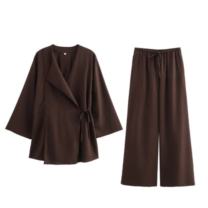 Brown coat and pants set on a white background