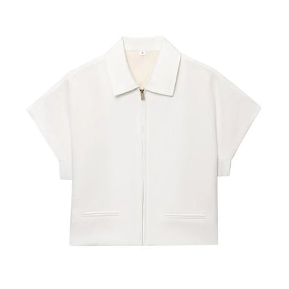 White zip-up shirt with short sleeves on a white background