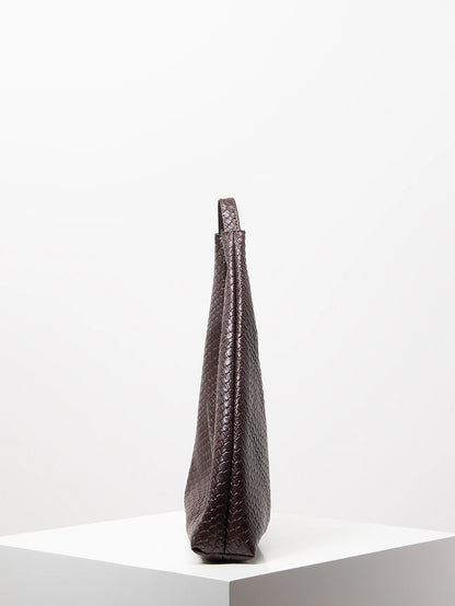 Dark brown textured handbag on a white background